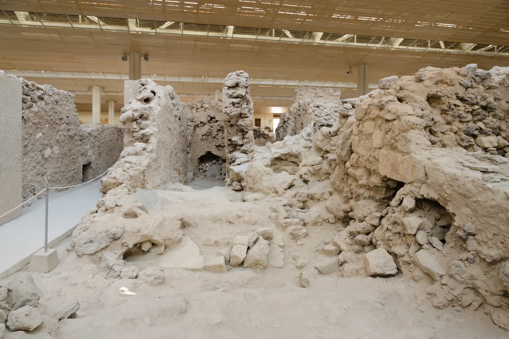 Excavated bronze-age streets and buildings inside the Akrotiri archaeological site